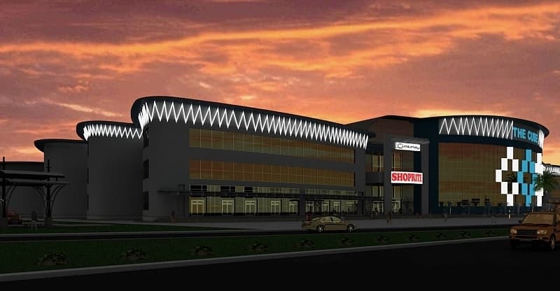 Nighttime architectural rendering of the illuminated retail complex and entrance